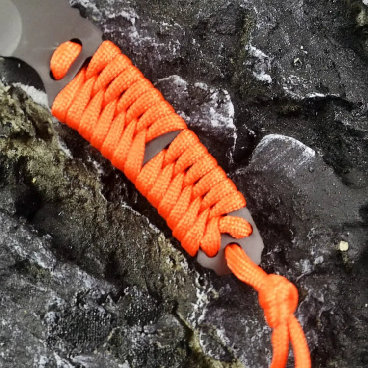 Camping knife with straight blade and rope bound handle showing ABS sheath