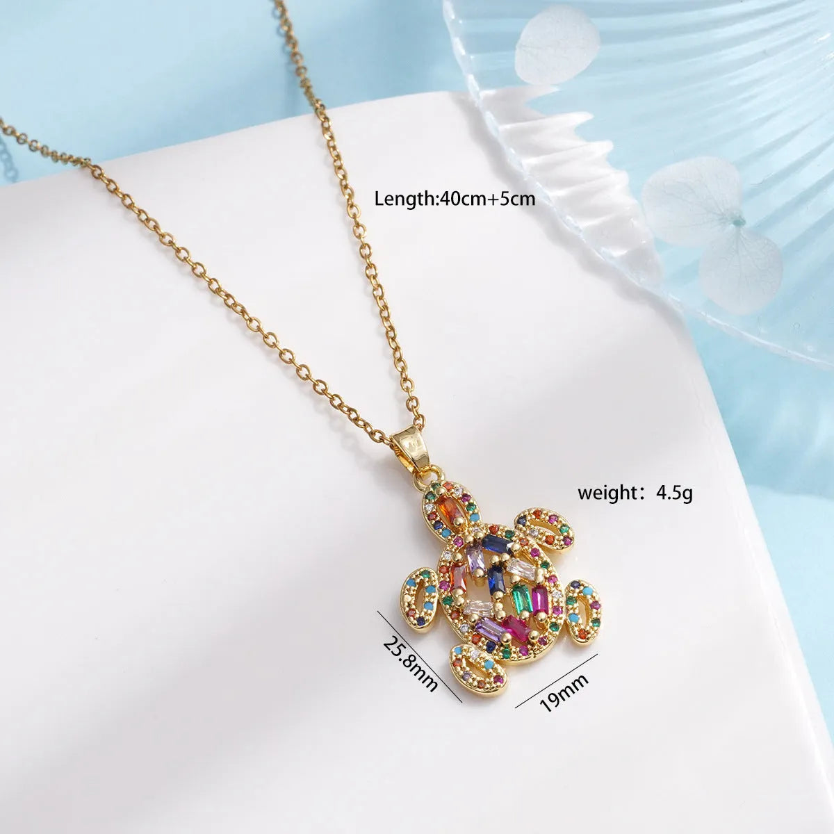Gold-plated copper sea turtle pendant necklace with mixed gemstone inlay and zirconium encrustation on titanium steel chain