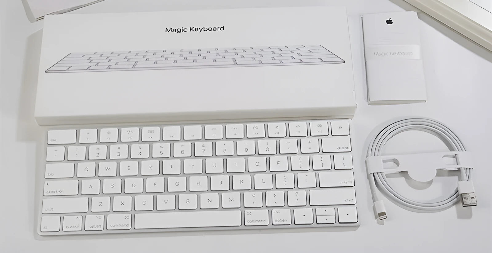 White Apple G6 Bluetooth wireless keyboard with ultra-thin metal casing.