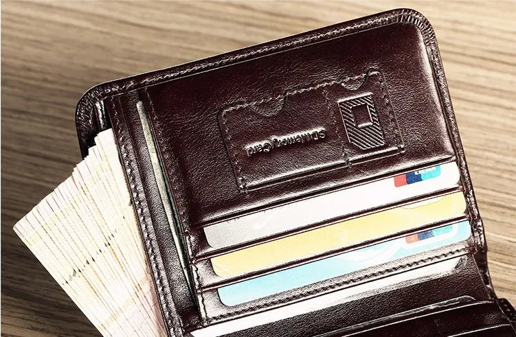 Men's black leather bifold RFID wallet open to show card slots, ID window, coin pouch, and banknote compartment.