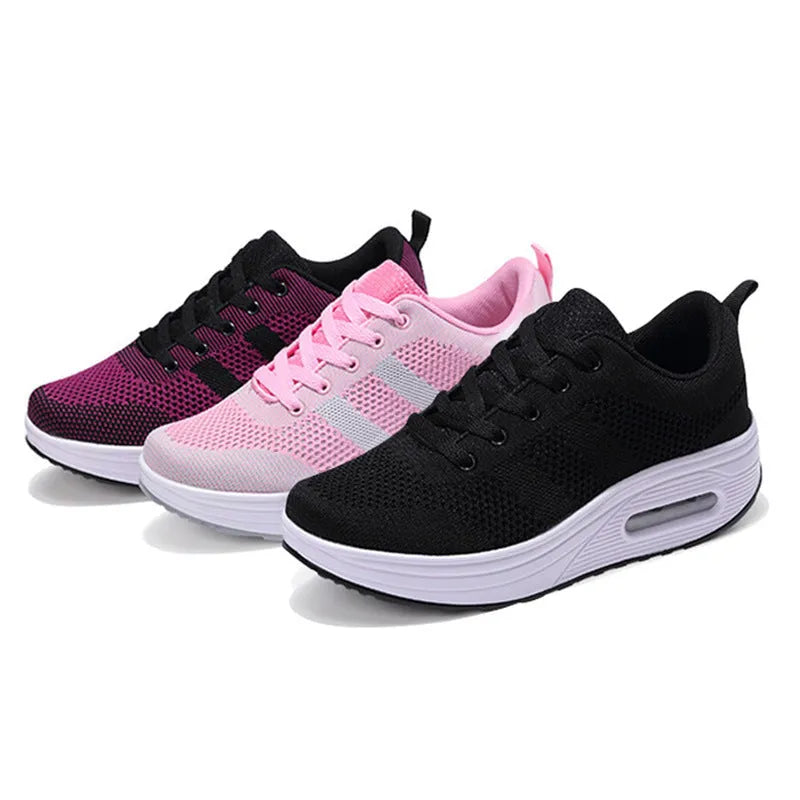 Women's platform casual shoes in black with a flyknit upper, T-shaped strap, and vulcanised sole.