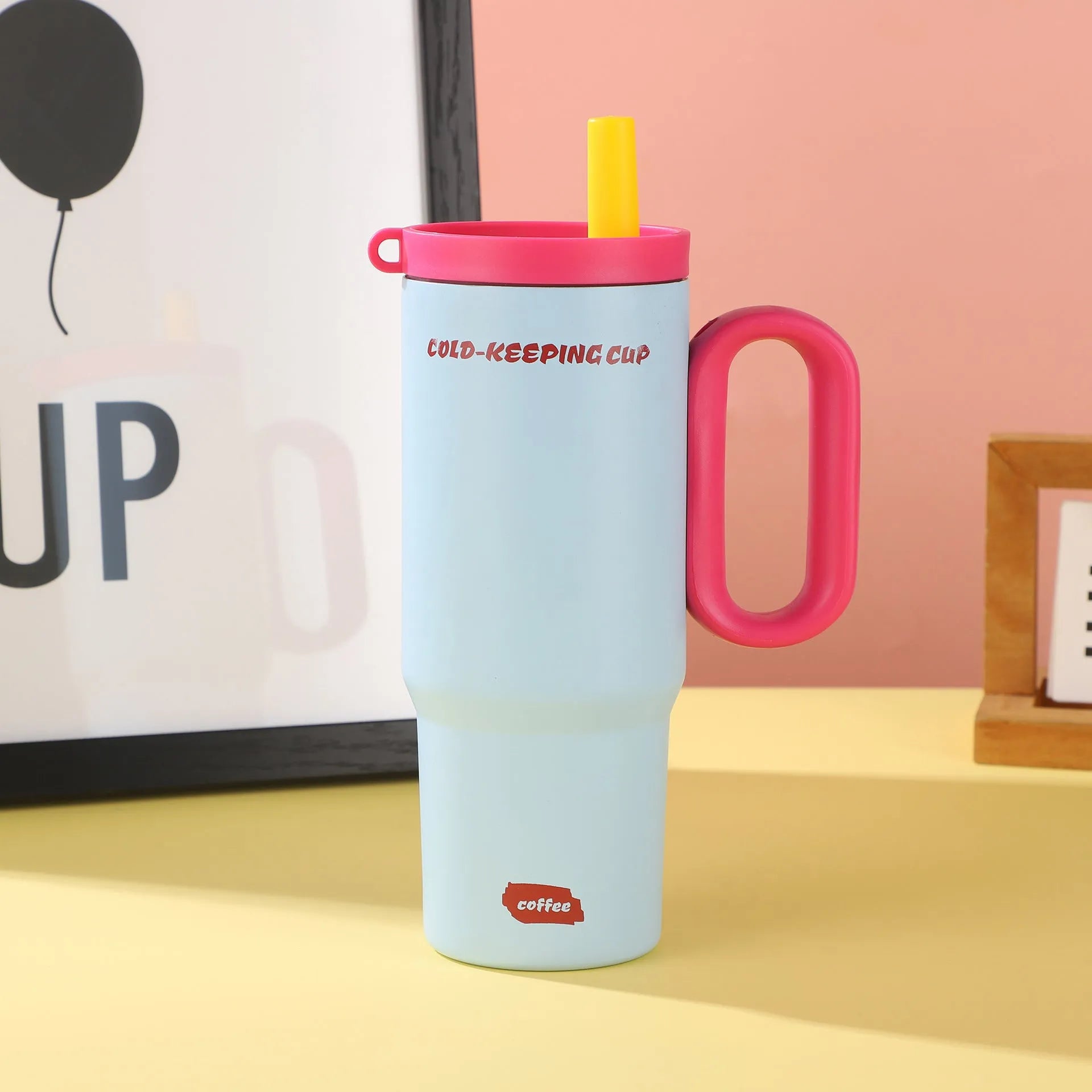 Insulated straw cup with handle showing 710ml capacity and leak-proof lid in assorted colours