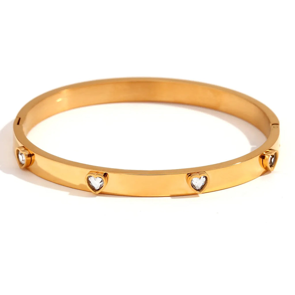 Stainless steel bracelet with micro-inlaid peach heart charm in golden electroplated colour