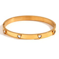 Stainless steel bracelet with micro-inlaid peach heart charm in golden electroplated colour