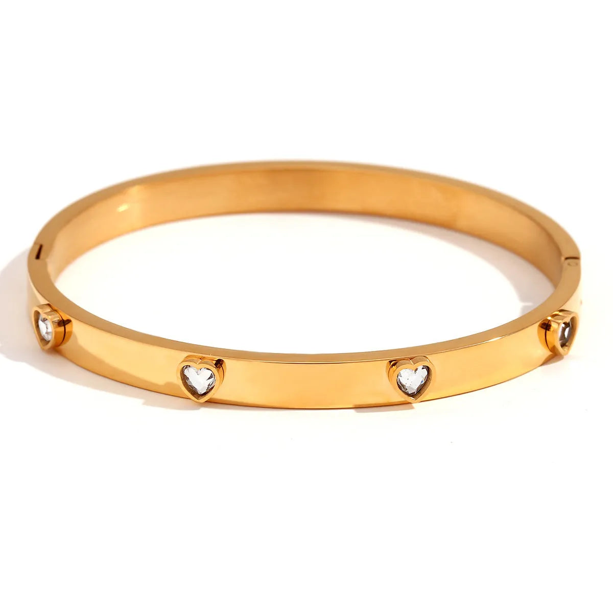 Stainless steel bracelet with micro-inlaid peach heart charm in golden electroplated colour