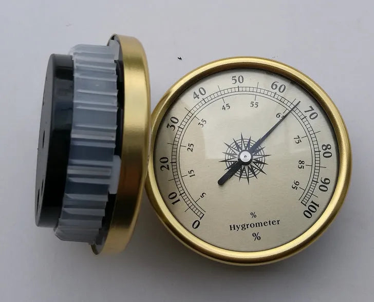 Circular aluminium analogue thermometer and hygrometer with temperature and humidity dials.