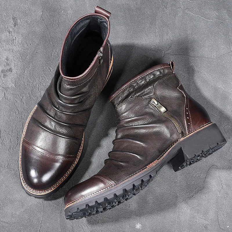Mid-calf black cowboy boot with side zipper, embossed pattern, round toe, and a mid-height heel.