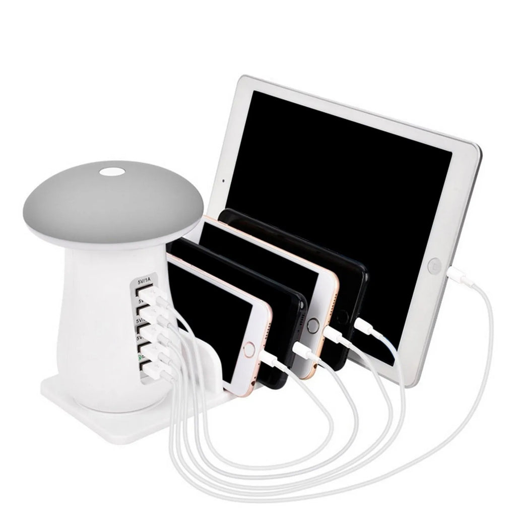 White mushroom-shaped LED light on a five-port USB charging station for phones and tablets