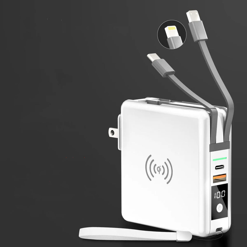 Black and white portable power bank with flip-out international plug adaptors showing PD20W and Qi wireless logos.