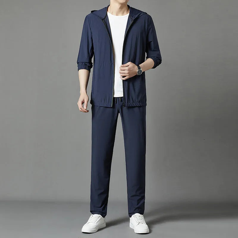 Korean style loose hooded sun-protective suit in grey, blue, or black, featuring top stitching pockets.