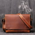 Vintage brown leather men's messenger bag with flap opening and adjustable shoulder strap.