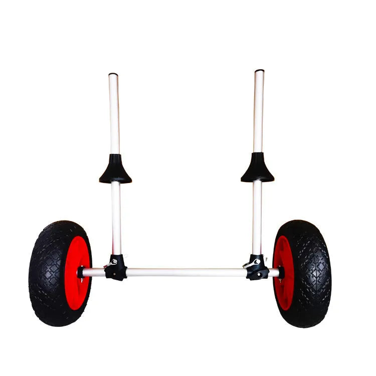 Foldable kayak beach trailer with aluminium frame and rubber wheels on sand.