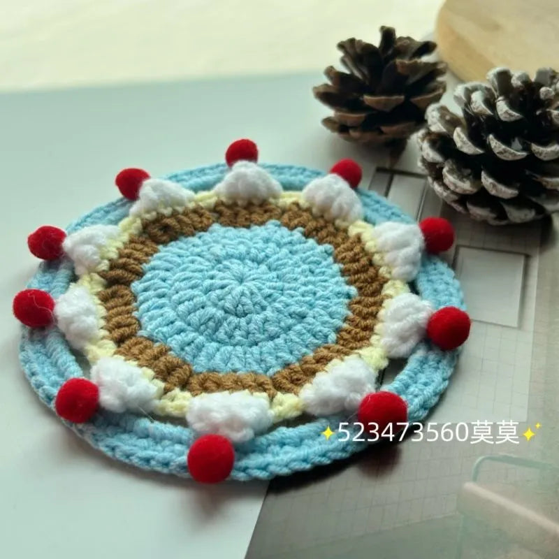 Handmade round wool coaster bag for hot mugs on a table