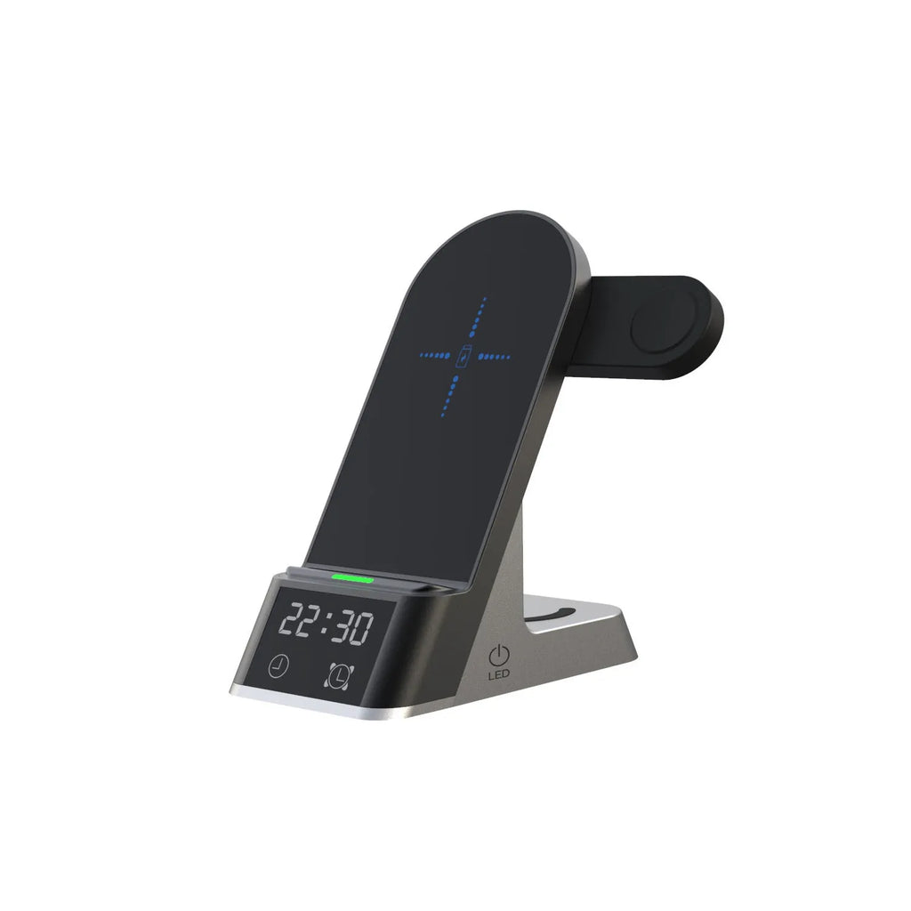 Black six-in-one alarm clock and wireless charging station on a desk.