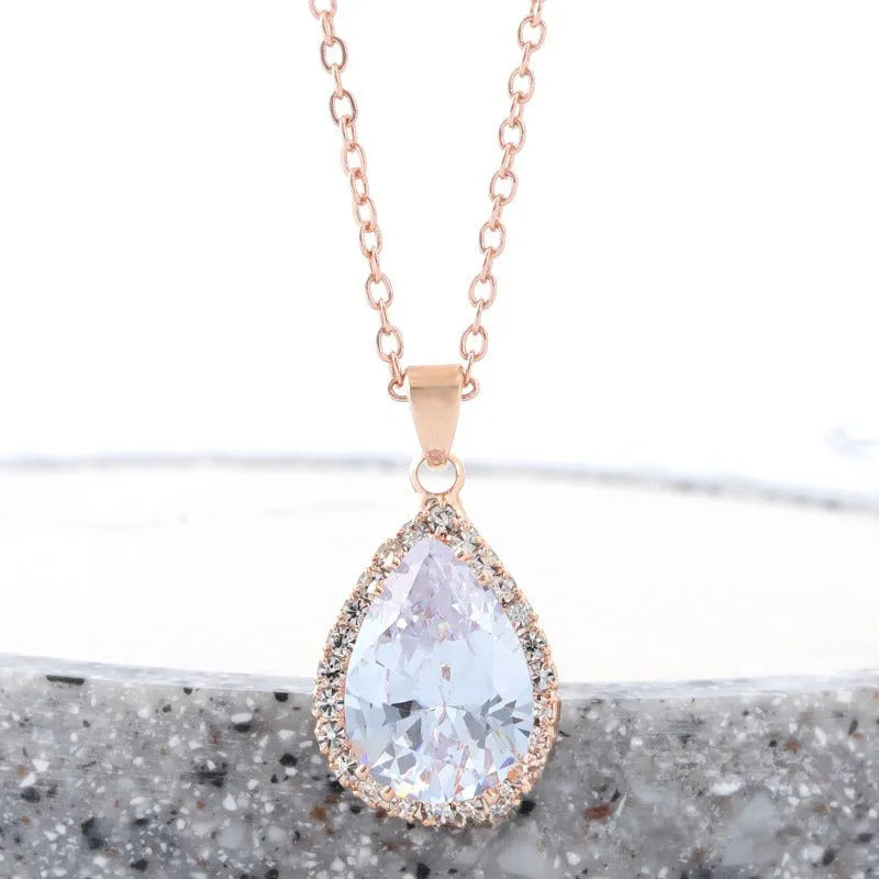 Rose gold water drop shaped women's necklace with geometric rhinestone decoration in pink colour