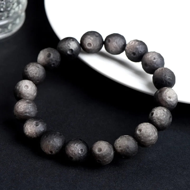 Natural obsidian meteorite crater ball bracelet with polished volcanic glass beads in silver or gold colours