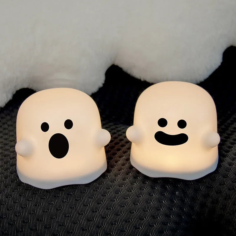 White portable LED touch sensor night light on a wooden bedside table.