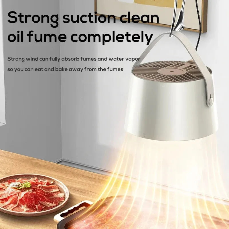 Milky white portable desktop exhaust fan with tripod stand and removable filter for kitchen smoke extraction