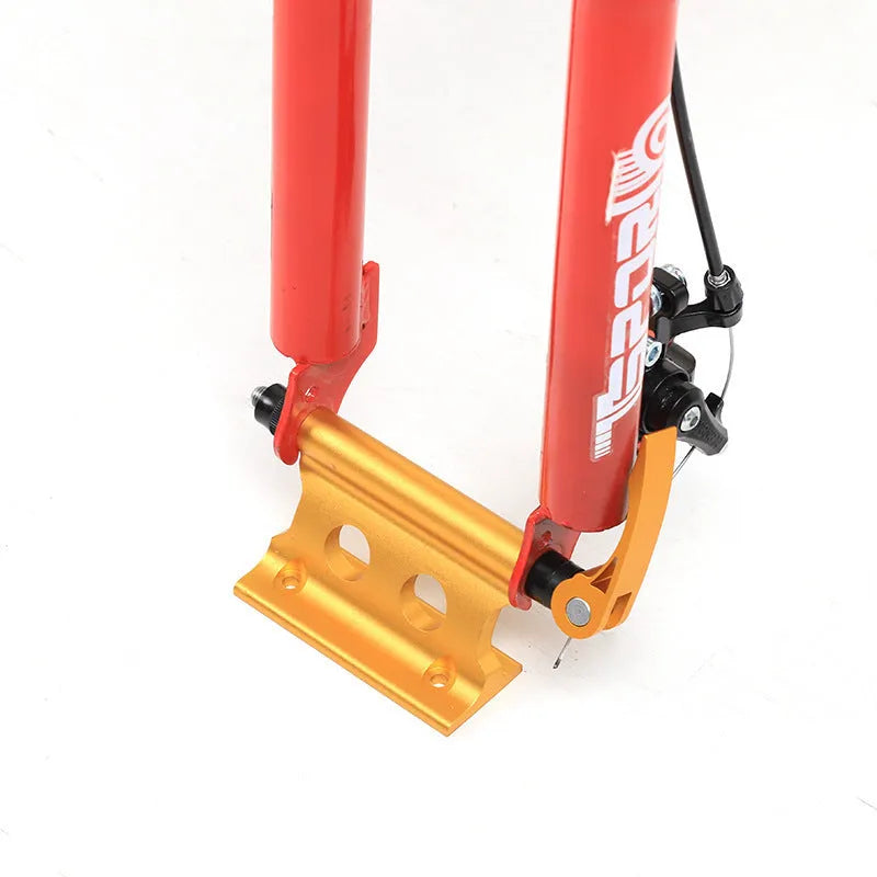Silver metal quick-release clamp for securing a bicycle front fork during transport.