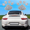 White diamond-encrusted car sticker patch showing butterfly and bear claw designs on a 7x6 cm glass base.