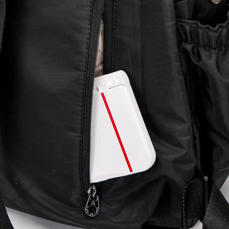Outdoor lightweight large capacity nylon backpack in black, shown with sandwich pocket detail.