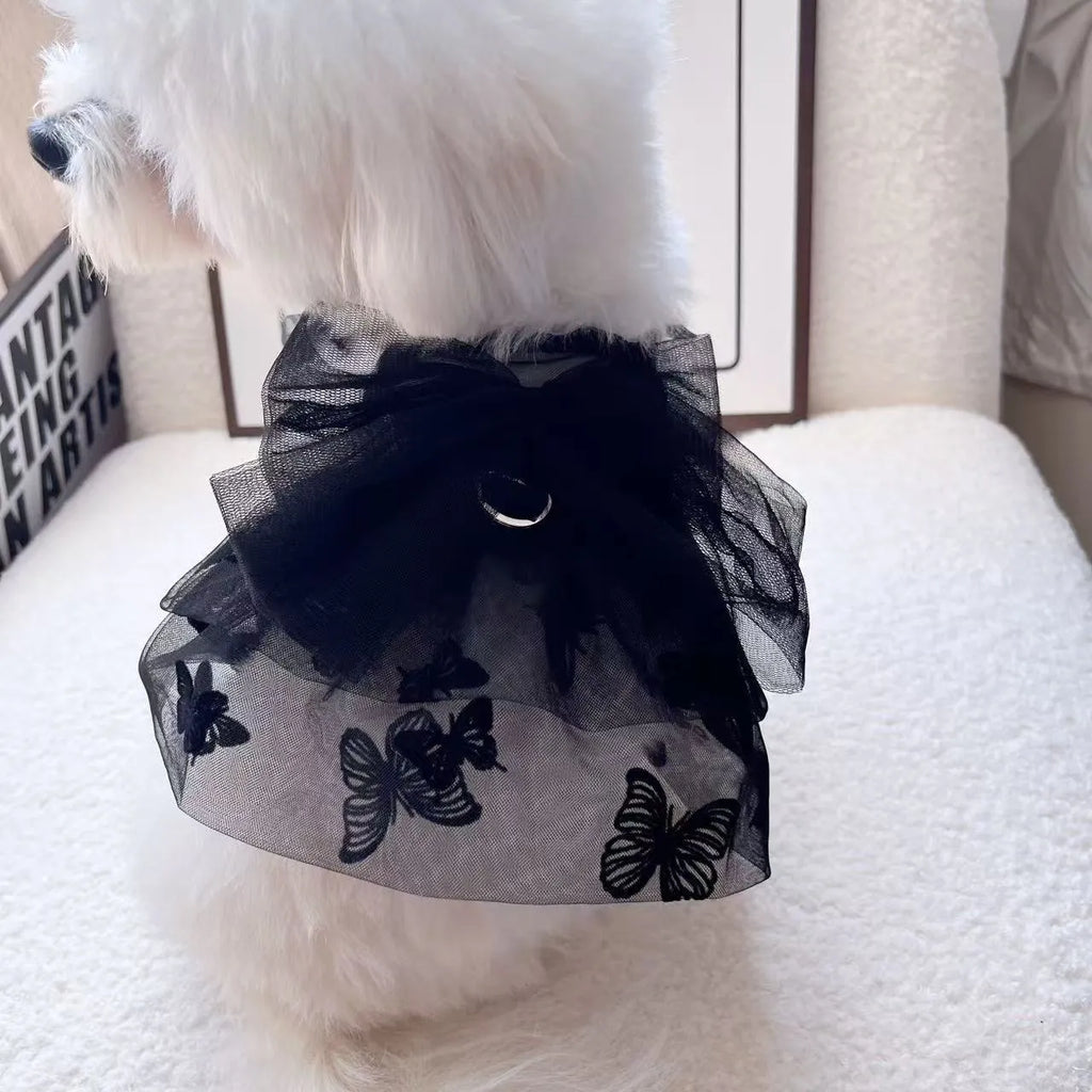 Black tulle princess skirt for a small dog or cat on a mannequin, showing layered gauze.