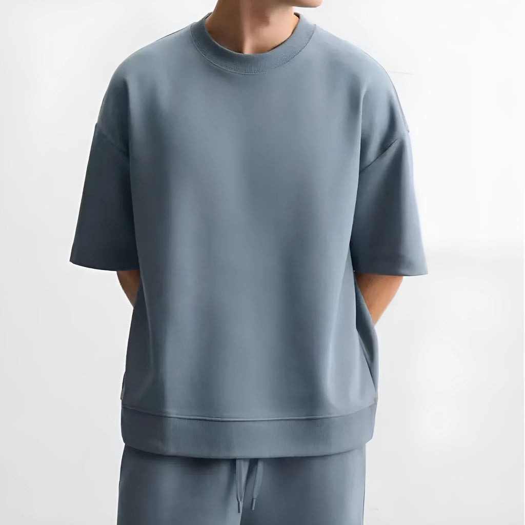 Men's loose fit round collar short sleeve top and matching shorts casual set in blue.