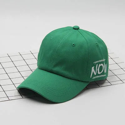 Cotton baseball cap with letter embroidery, adjustable back, curved brim, in beige on white background