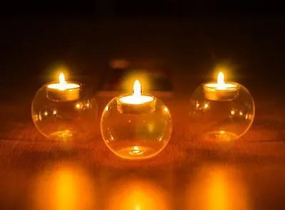 Clear handmade round glass bowl candle holder in three sizes: 10cm, 12cm, and 8cm diameter.