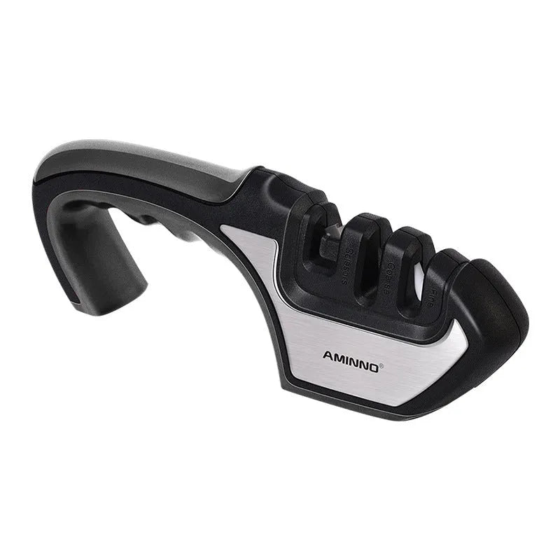 4-in-1 kitchen knife sharpener in black plastic with multiple sharpening slots.