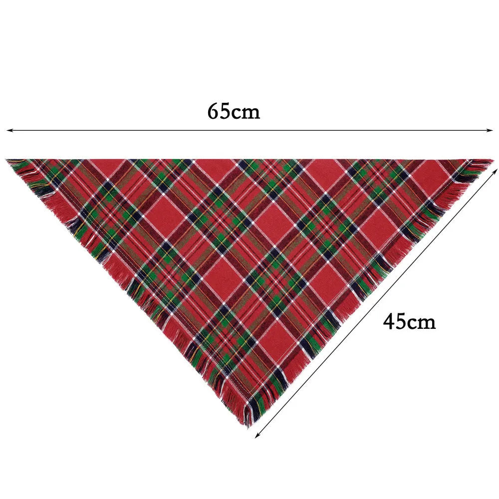 Plaid triangle dog bandana with tassels in autumn colours on a dog's neck.