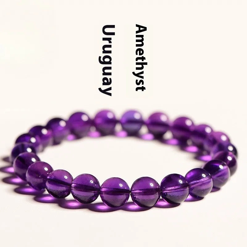 Natural amethyst scattered bead bracelet on a single strand, showing polished crystal stones.