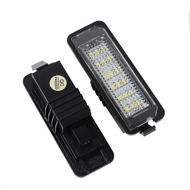 Pair of white LED license plate light bulbs for Volkswagen Golf, Polo, and Phaeton models.