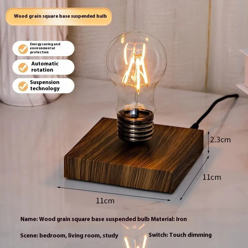 Small black suspension bulb night lamp with iron art body on a wood grain base for desktop decoration.