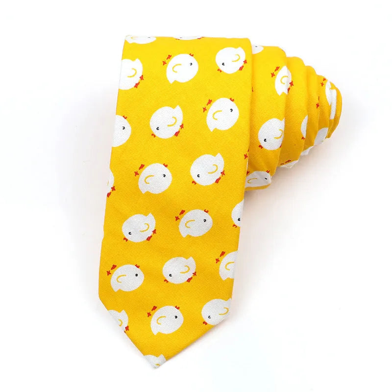 Narrow Korean style cotton bow tie with a printed cartoon pattern on a solid colour background.