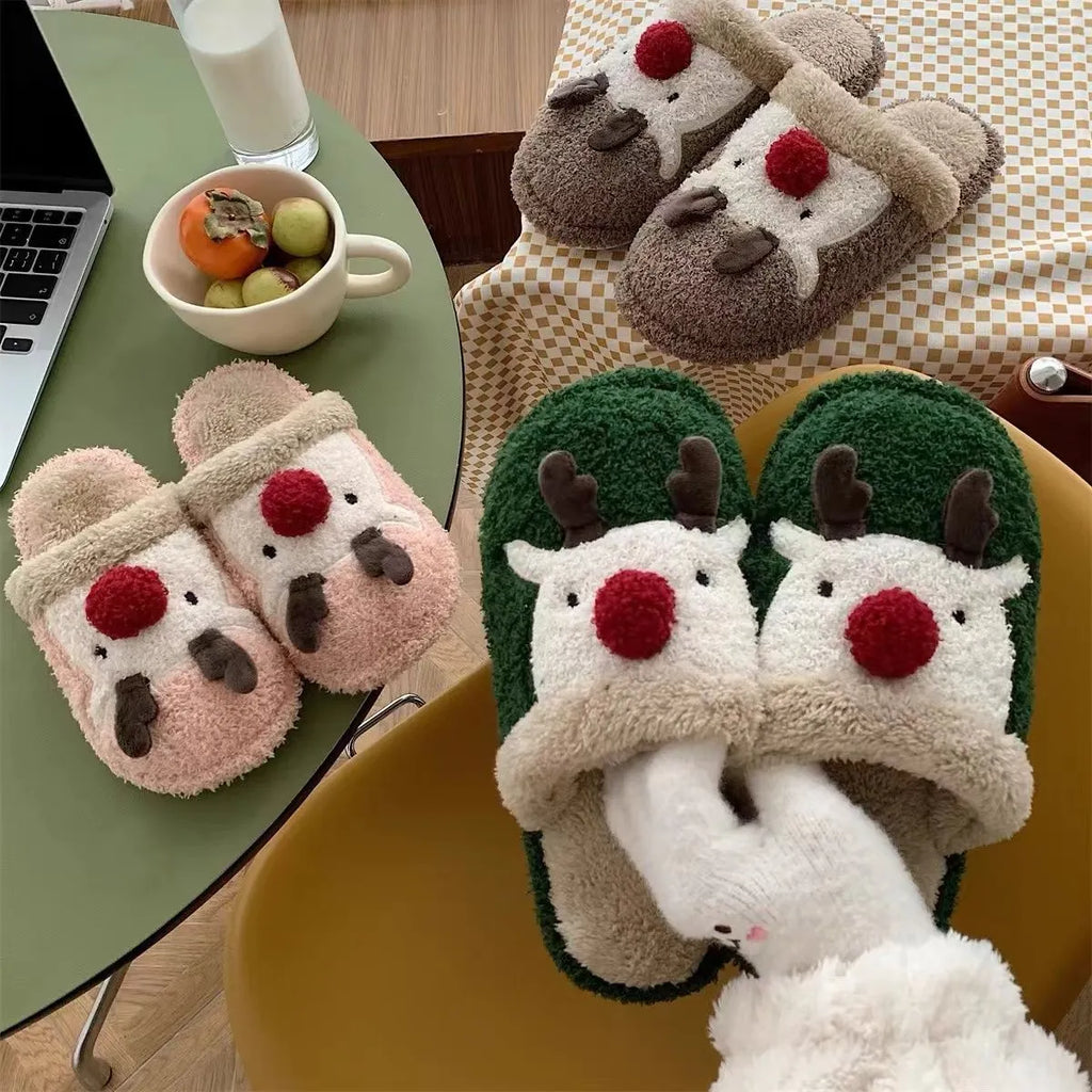 Women's brown Christmas deer plush slippers with a non-slip PVC sole.