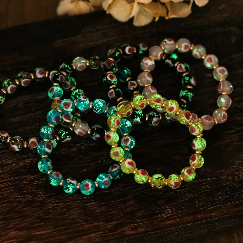 Handmade fluorescent glaze bracelet with swallowing gold beast motif on heart-shaped 10mm beads