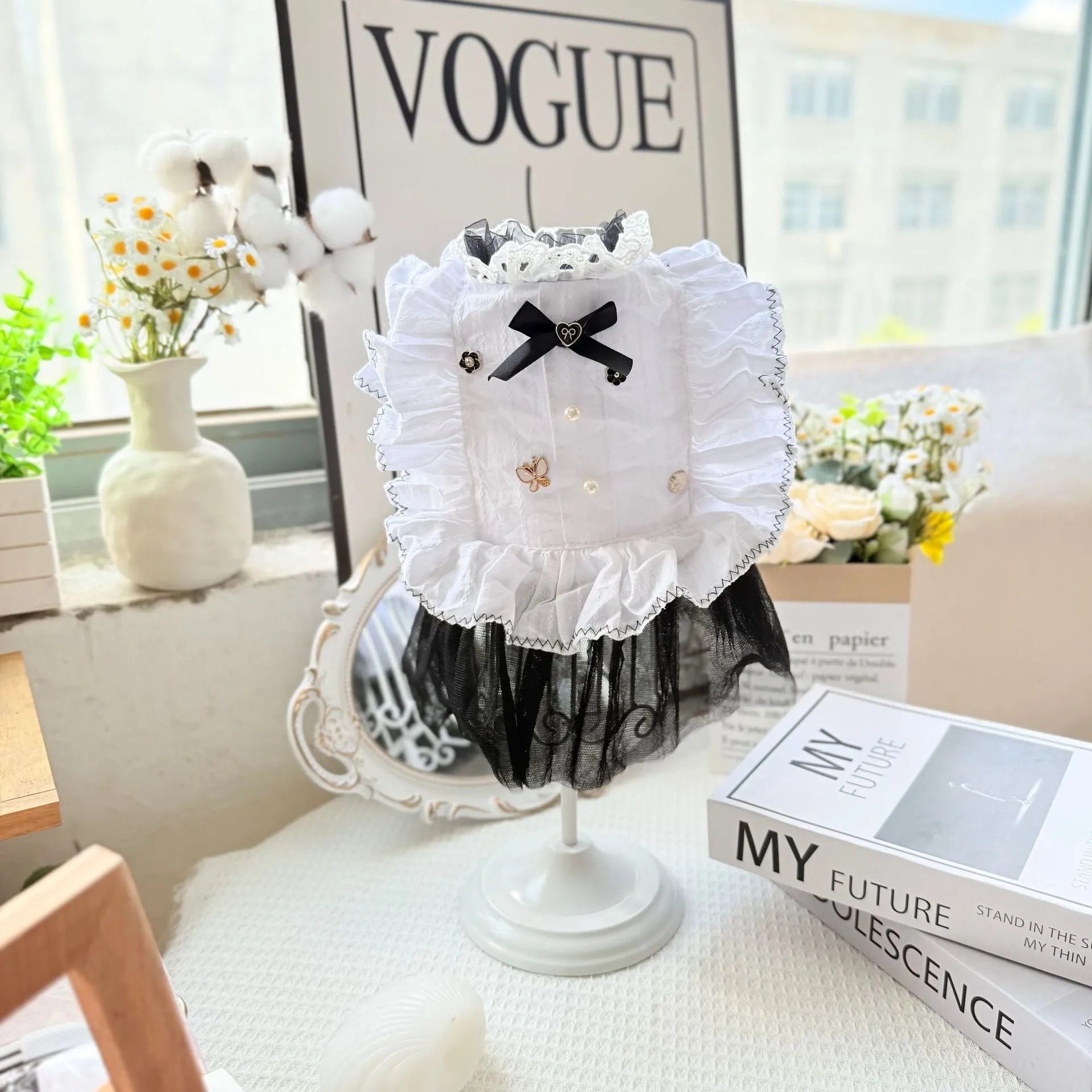 White polyester princess-style gauze skirt dress for a small dog on a mannequin.