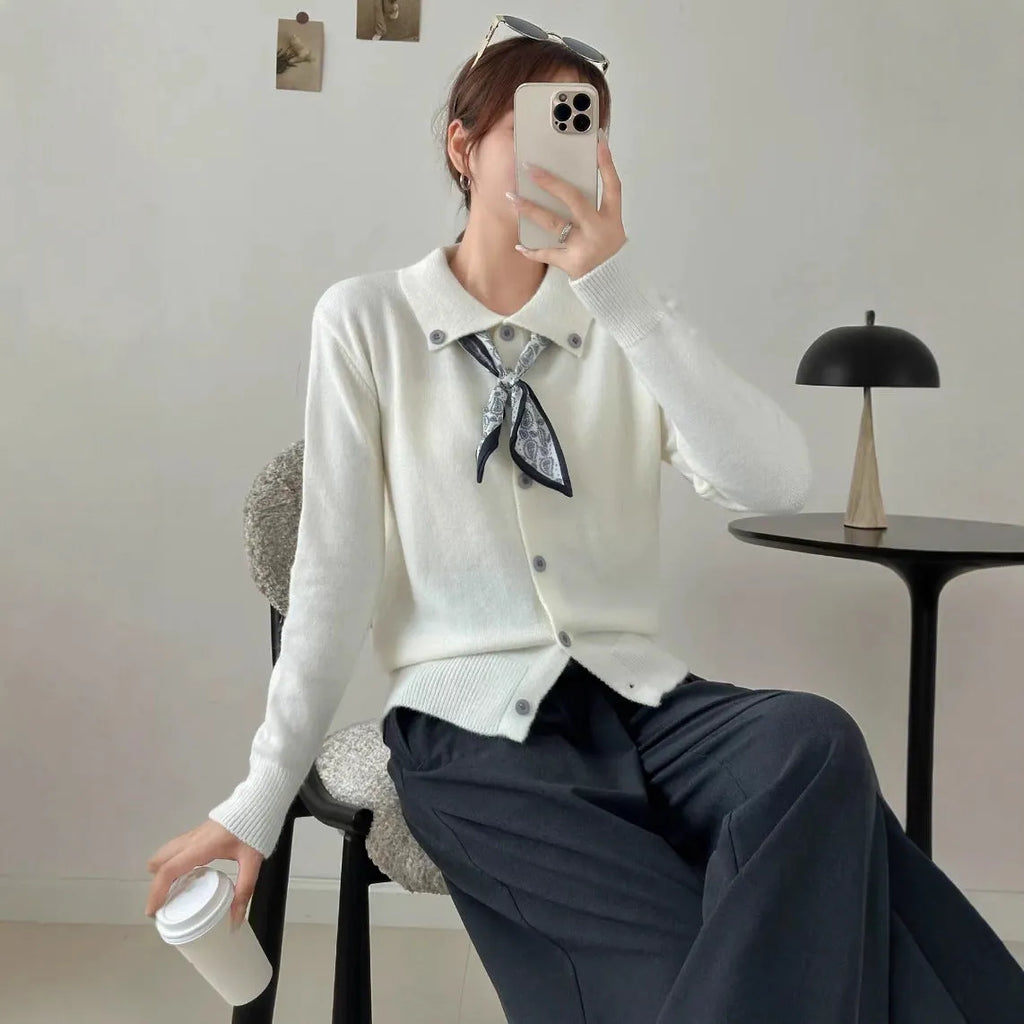 Acrylic fibre lazy fashion cardigan sweater with integrated lapel scarf in a neutral colour.
