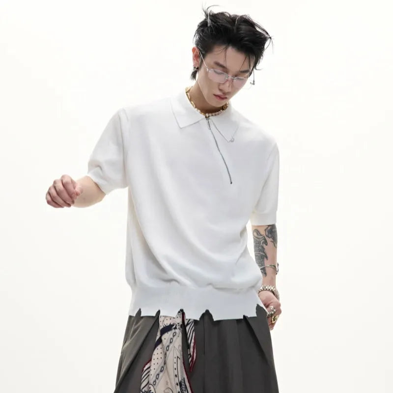 Men's slim-fit black knitted polo shirt with an oblique diagonal zip and short sleeves.