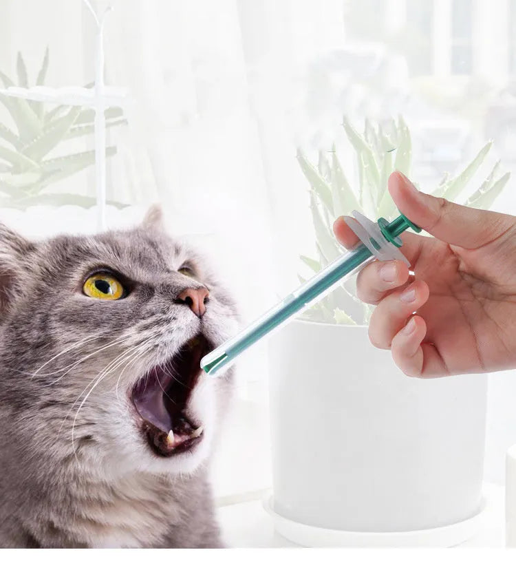 Two pet pill shooters with soft silicone tips in different sizes for cat and dog medication