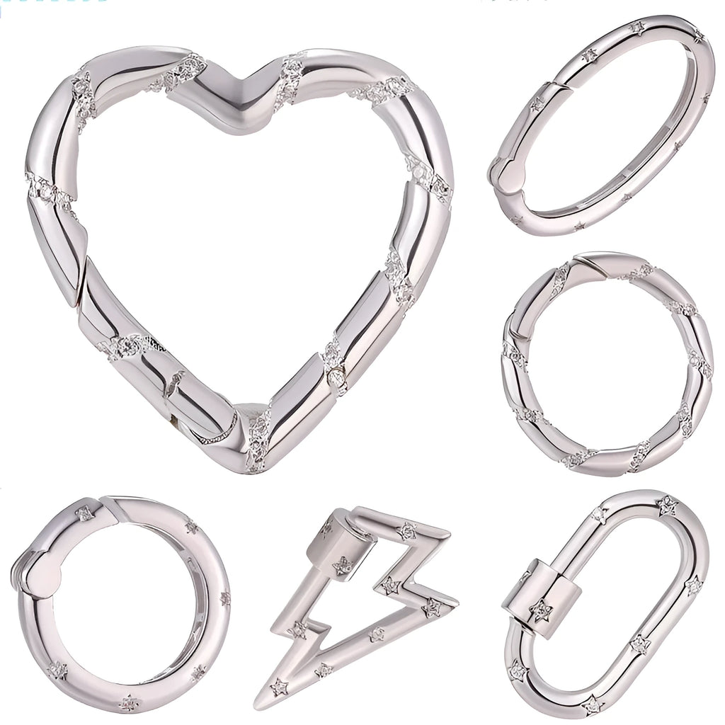 Gold electroplated copper heart-shaped button with micro-inlaid zircon stones and a selection of fastener types.