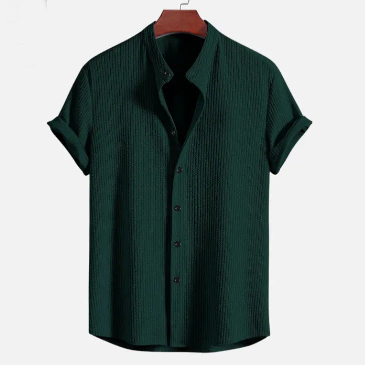 Men's loose fit short sleeve casual shirt in light blue, showing front view on a hanger.