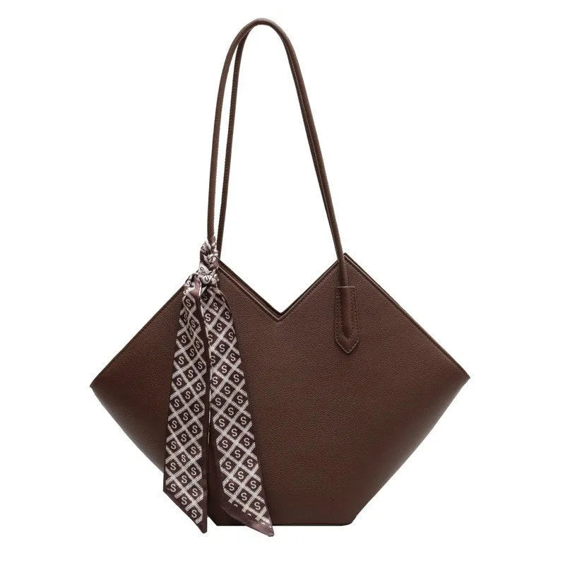 Women's large black PU leather shoulder bag with horizontal square shape and sandwich pocket.