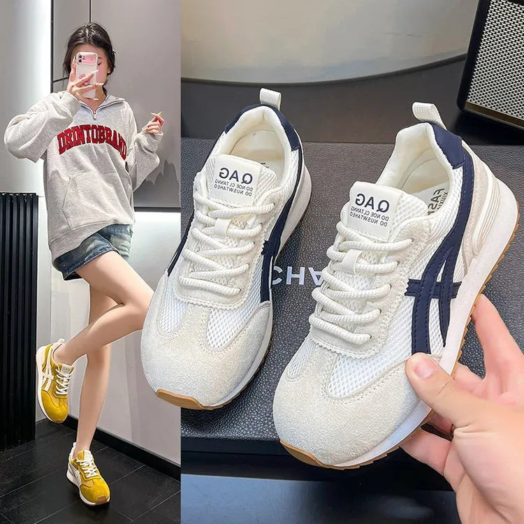 Women's white low-top lace-up sneakers with round toe on a flat plastic sole.