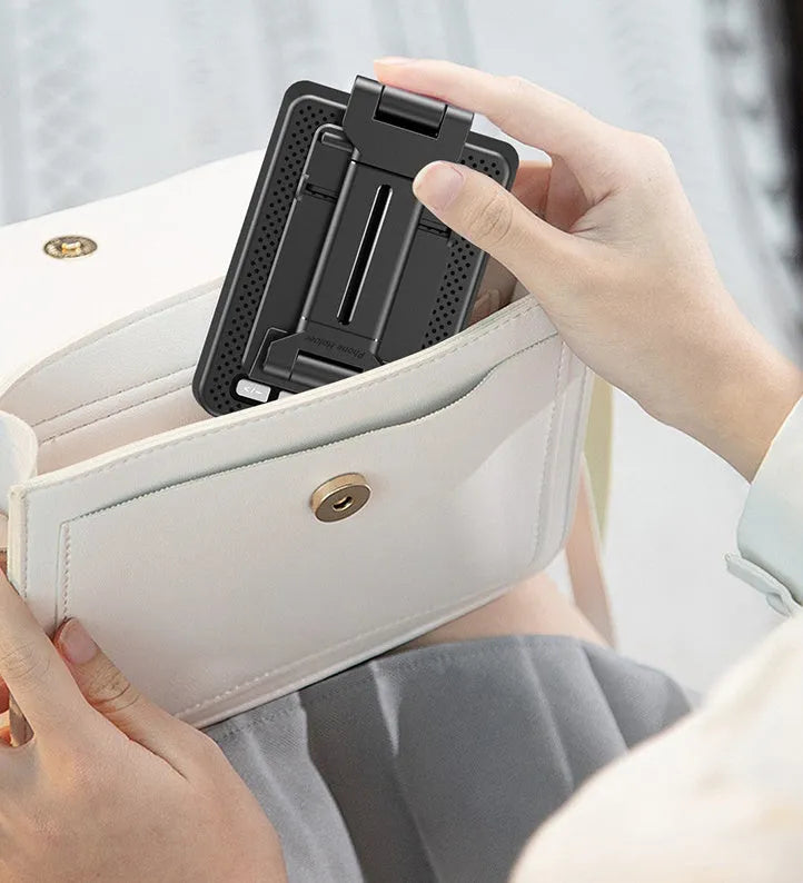 Black Bluetooth speaker phone stand with microphone for live streaming, showing phone holder and charging port
