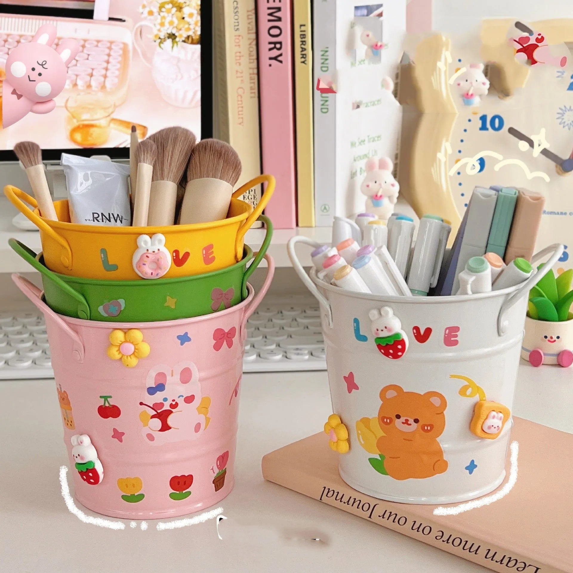 Round metal creative iron art pen holder on a desk, shown in a choice of solid colours or with sticker patch accents.