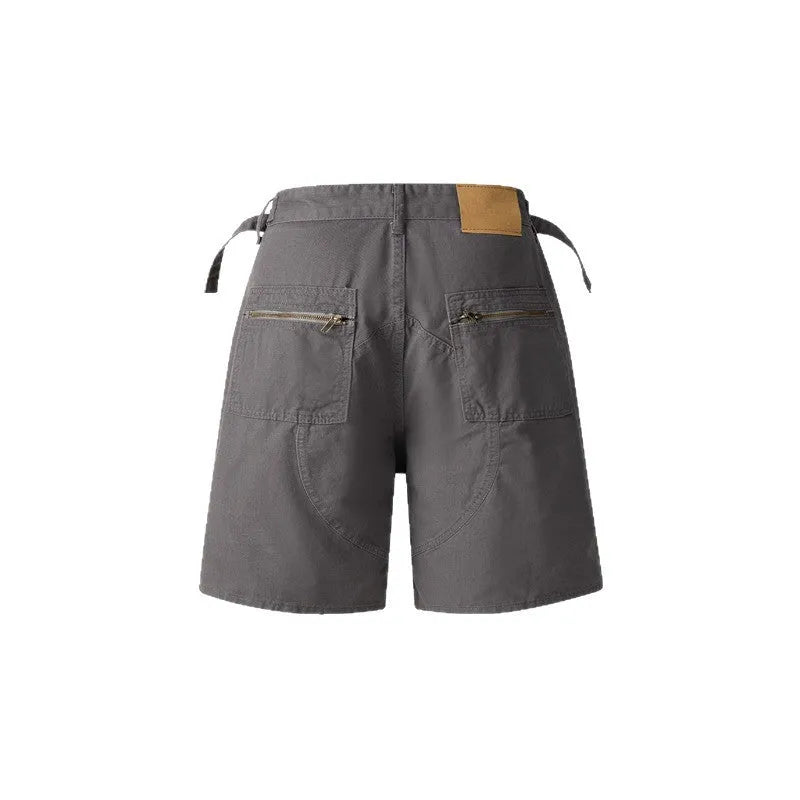 Retro washed cotton shorts for men and women with a zip fly and loose fit, shown in grey, green, camouflage, or blue.