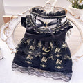 Golden gothic princess skirt costume on a small dog, showing the pet clothing design.