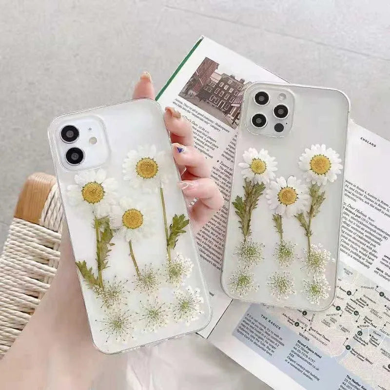 White clear epoxy daisy floral design TPU phone case for iPhone, shown from the back.